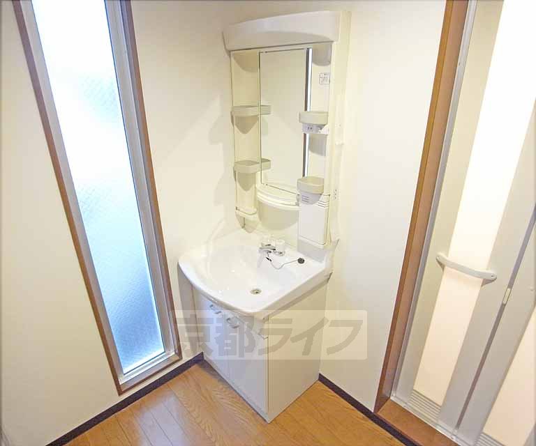 Washroom. It has a separate wash basin.