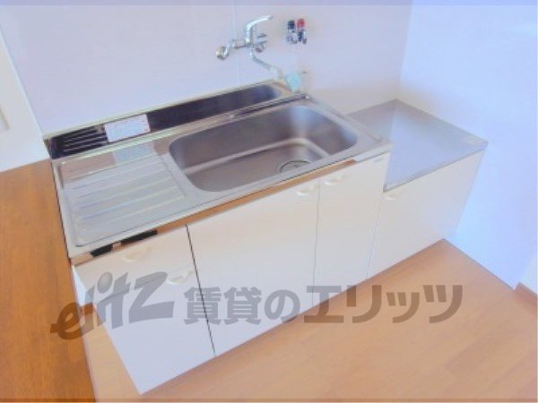 Kitchen. Kitchen table is also large.