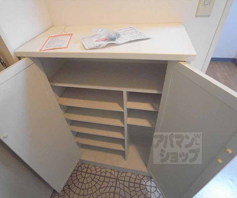 Other room space. It is the front door of the cupboard.