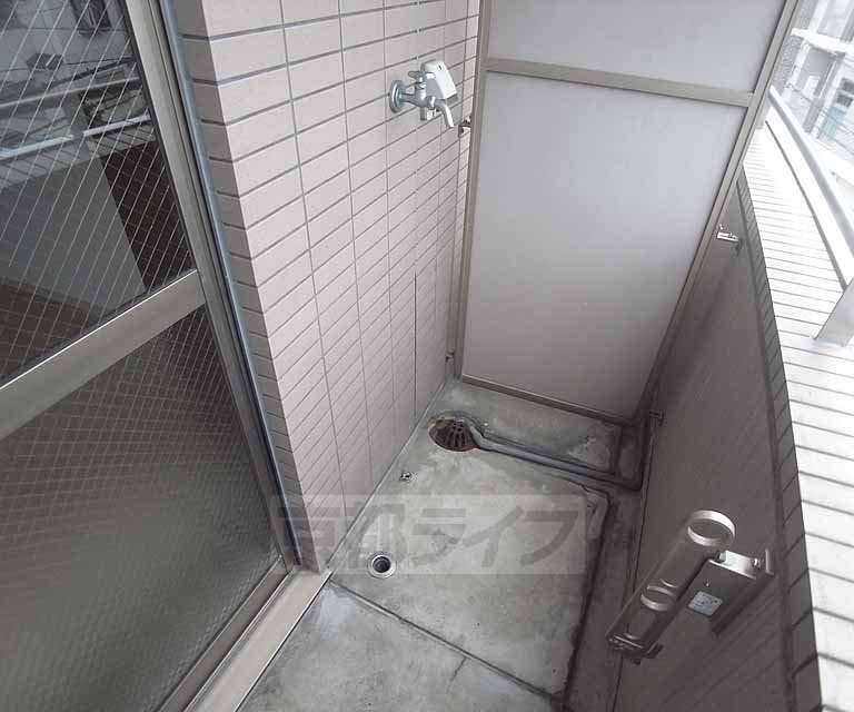 Balcony. Washing machine is installed outdoors.