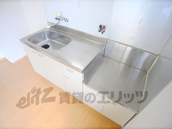 Kitchen. Happily cooking in bright kitchen.