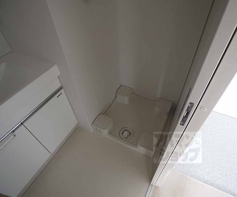 Other room space. Washing machine in the room