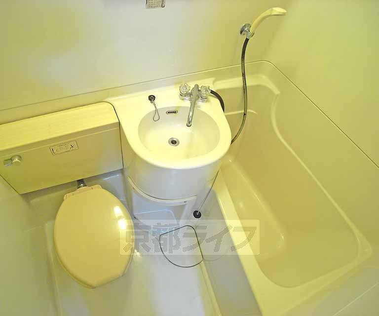 Bath. It is with wash basin.