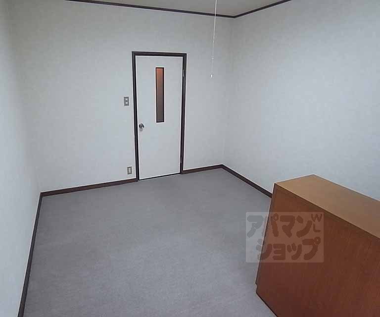 Entrance. With partition door between the back of the living room