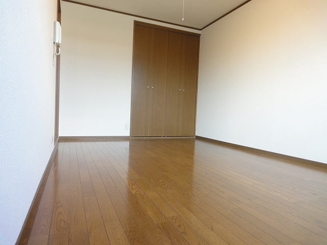 Living and room. It is a photograph of another room.