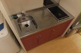 Kitchen. Two-burner electric stove and cooking space reserved