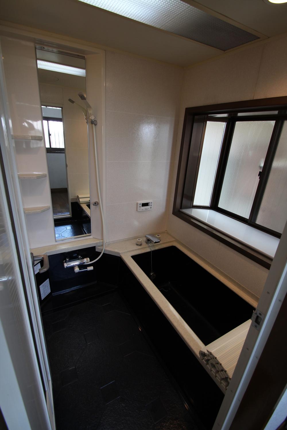 Bathroom. There is a window in the bathroom