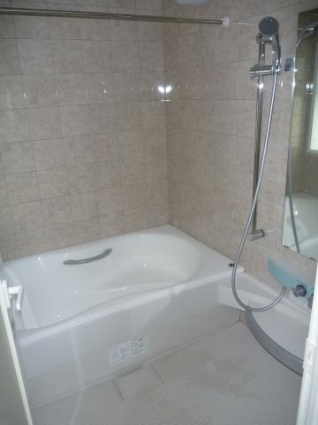 Bathroom. It is with the bath shower