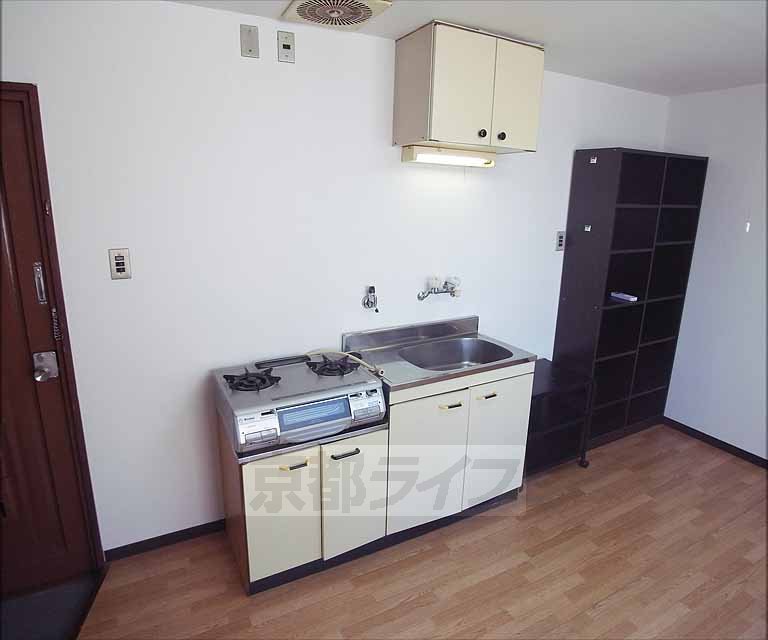 Kitchen. Two-burner stove is the put spread of kitchen.