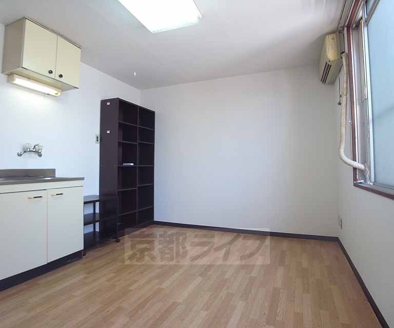 Living and room. Now it is put a shelf in the room.