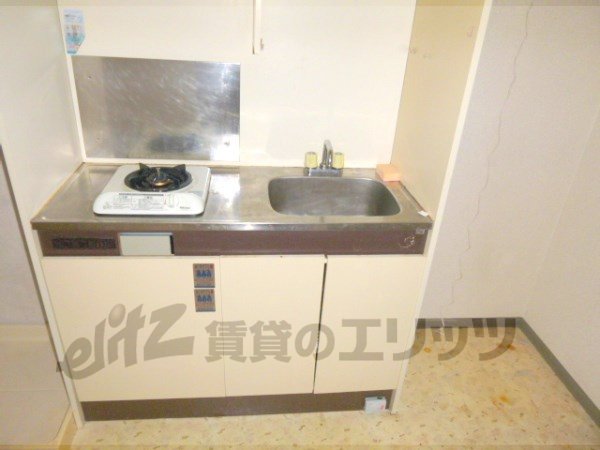 Kitchen. Put the refrigerator next to "