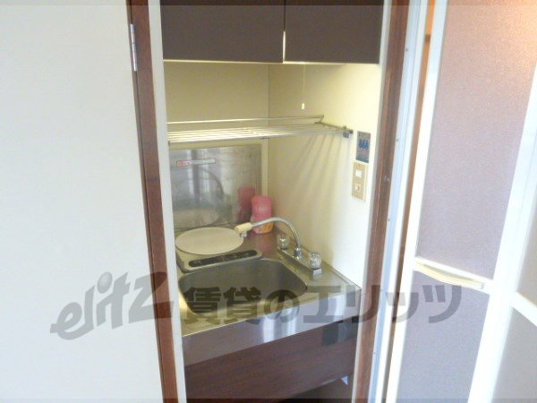 Kitchen. It is a compact kitchen.