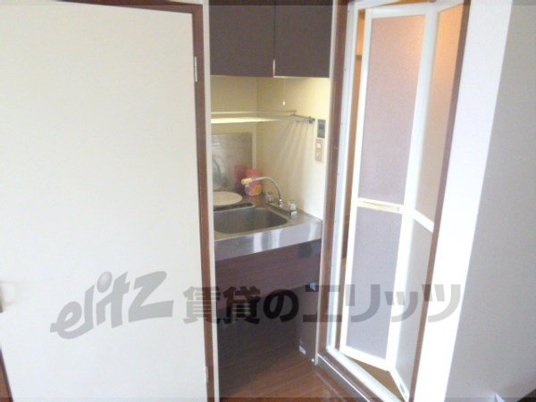 Kitchen. It is a compact kitchen.