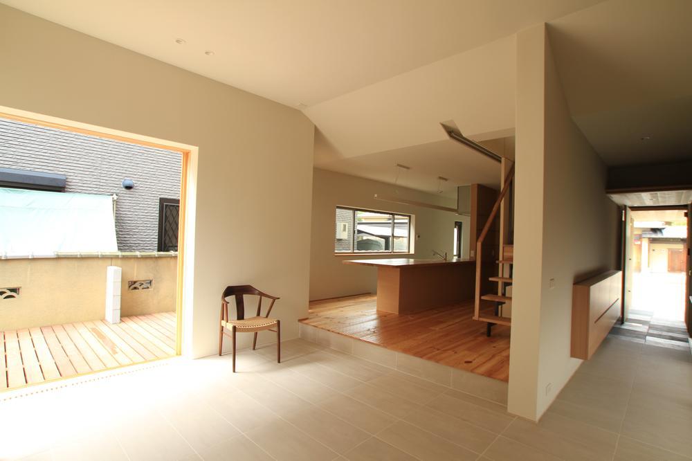 Living. Spacious living space there is a wood deck and a sense of unity