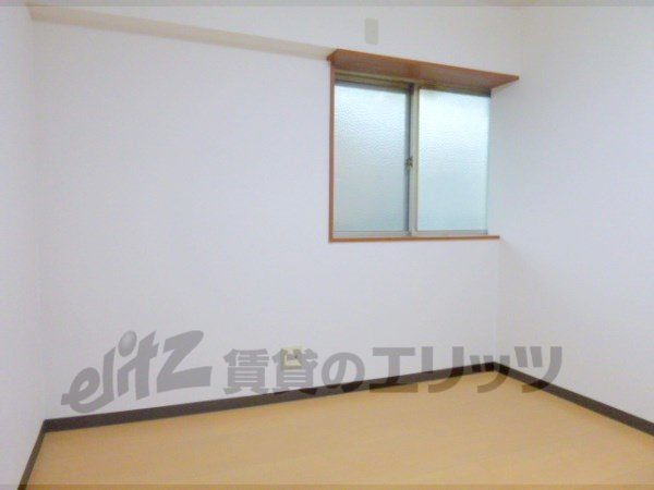 Living and room. It is bright because there is a window