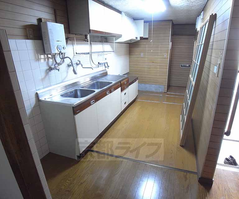 Living and room. It is a large kitchen sink!