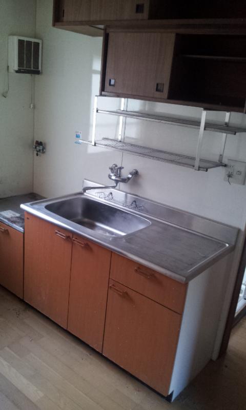 Kitchen. It is with hanging cupboard in the kitchen. 