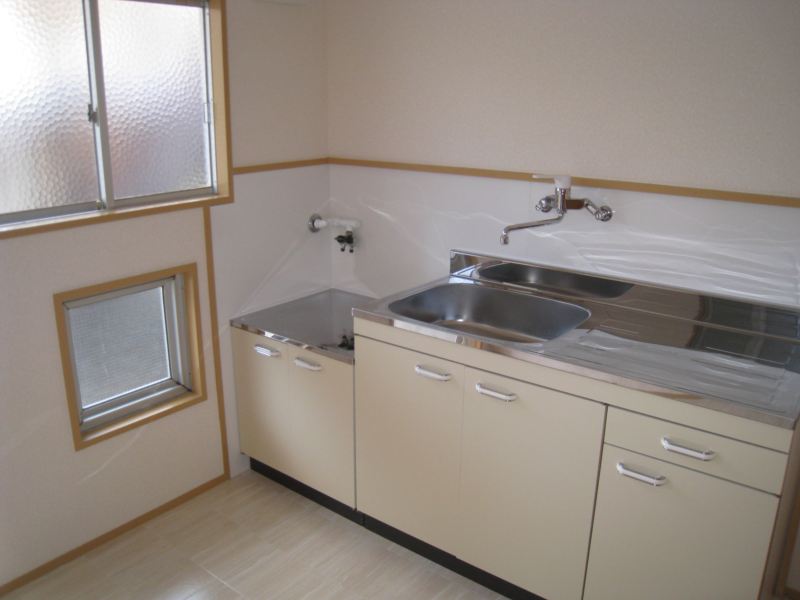 Kitchen. It is a bright kitchen with a window