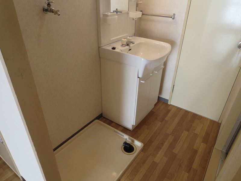 Washroom. There is storage room washing machine