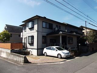 Parking lot. Garage There are two cars. 
