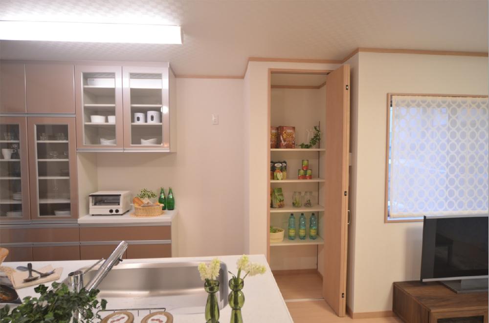 Kitchen. The model house also has a cupboard and pantry