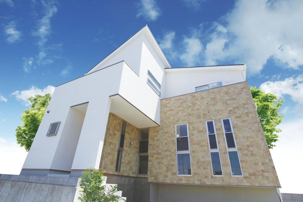 Local photos, including front road. Model house towering on a hill spread is rich vista under eyes