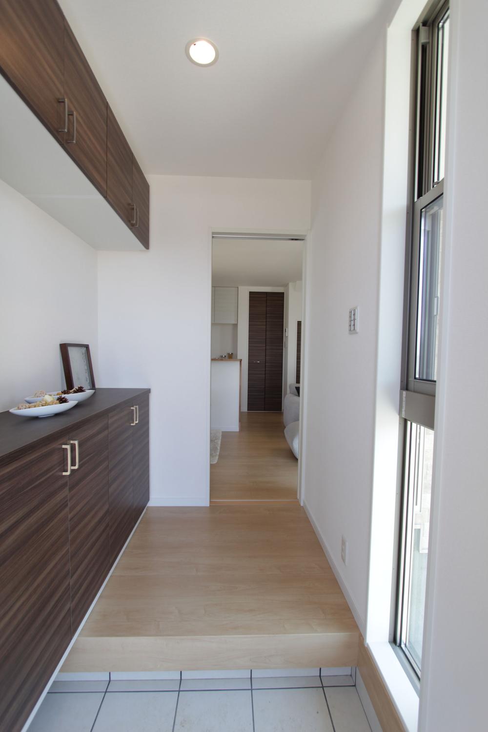 Entrance. It gives a light and airy impression there is a window in the front door.