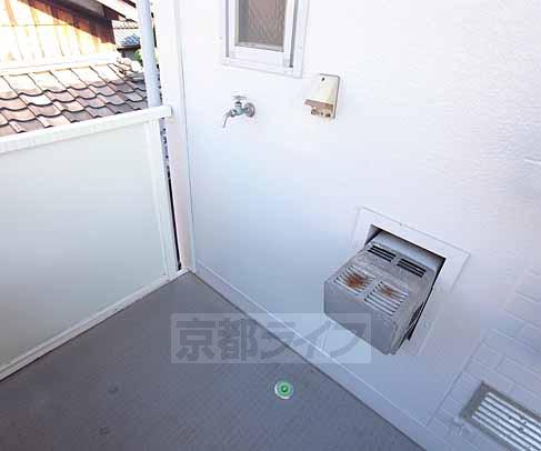 Other room space. Washing machine is put to the outdoor.