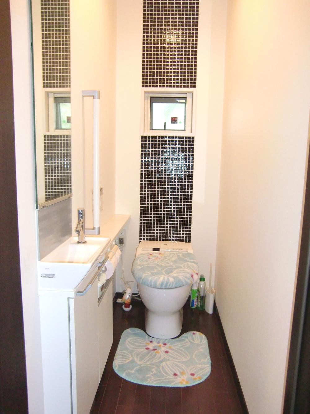 Toilet. Hand washing is on the first floor toilet, handrail, Storage has provided
