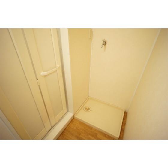 Other room space. Washing machine in the room