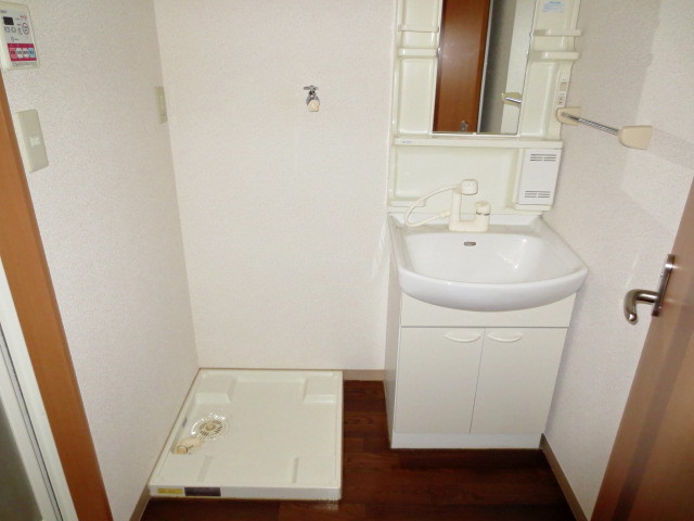 Washroom. Washbasin with shower, Laundry Area
