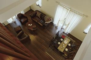 Living room looking down from the second floor hall ・ dining