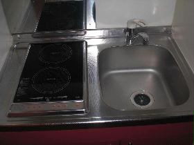 Kitchen. It is a two-burner stove electromagnetic type.