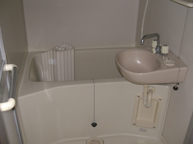 Bath. Wash basin is separate from the bath.