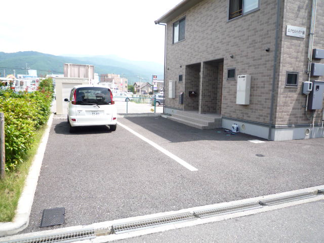Parking lot. Parking reserved 2 cars in tandem to each household
