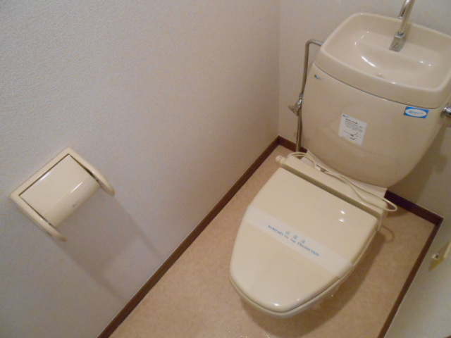 Toilet. Heating toilet seat equipped