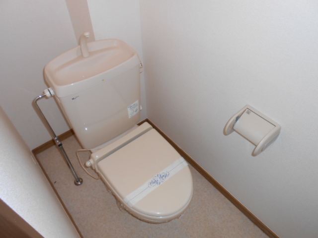Toilet. Heating toilet seat equipped