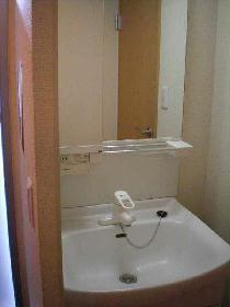 Washroom. It is the washstand. There are storage pockets on the back of the mirror.