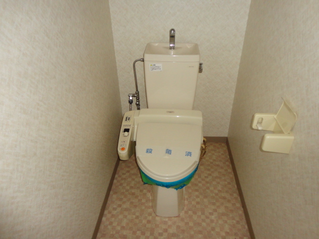 Toilet. Photos will be inverted type.