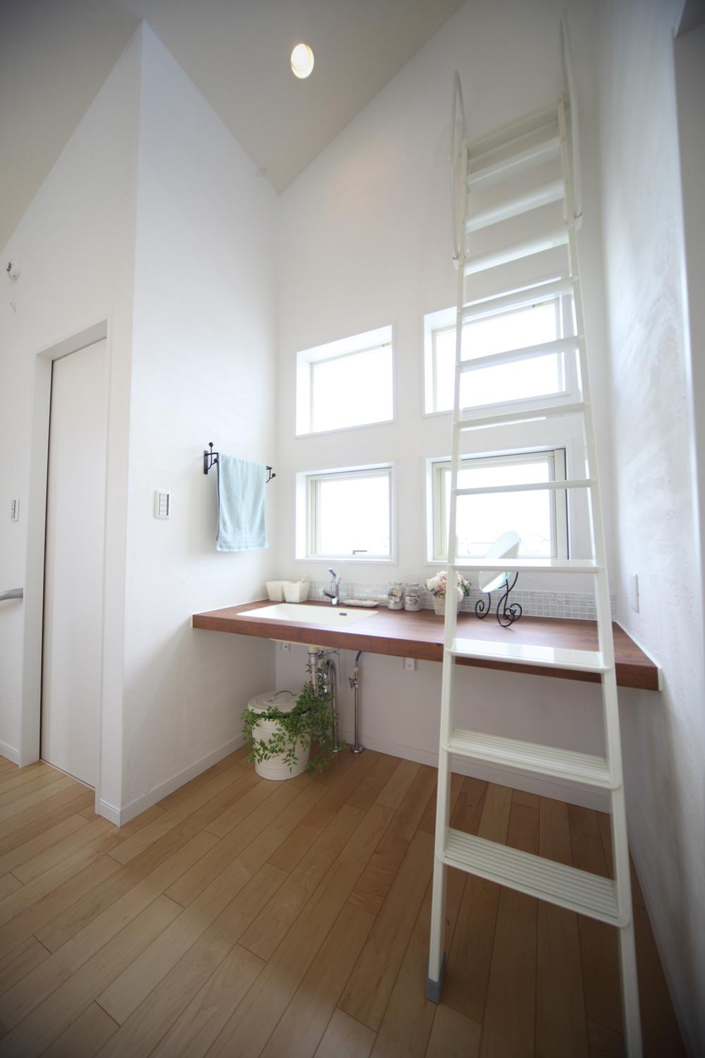 Wash basin, toilet. Second floor sanitary space. 