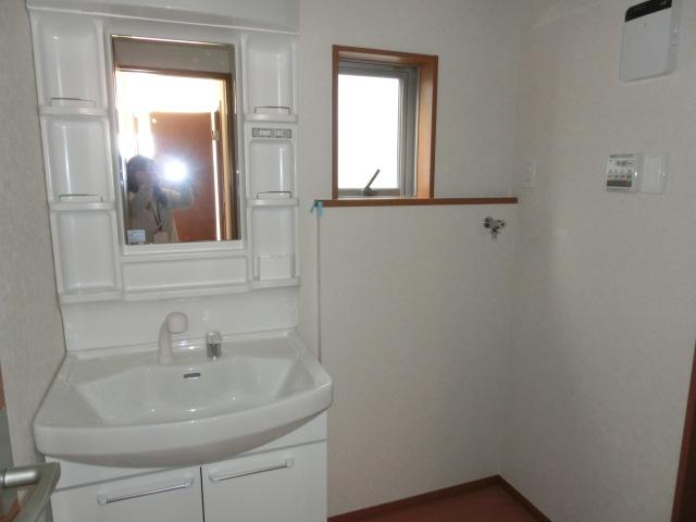 Wash basin, toilet. Wash room with a space, even hectic morning