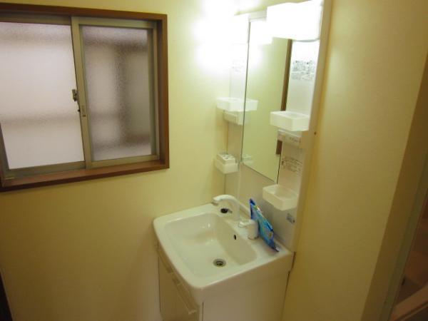 Wash basin, toilet. Vanity is a new article