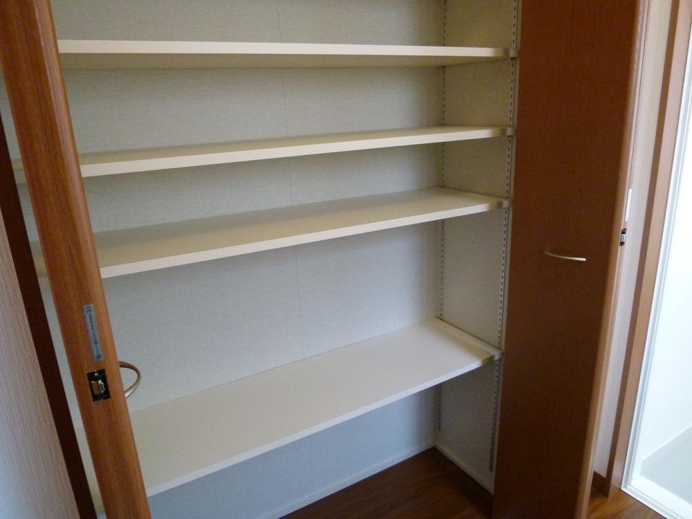 Wash basin, toilet. A lot of storage in the washroom