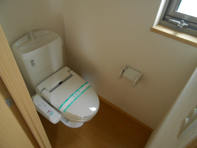 Toilet. It is with warm water washing toilet seat!