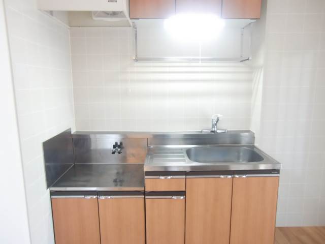 Kitchen. Also put two-burner stove!
