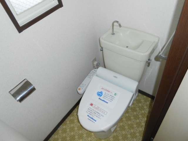 Toilet. It is with warm water washing toilet seat!