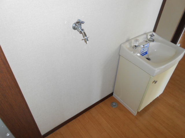 Washroom. It is indoor washing machine Storage!