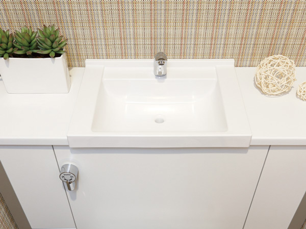 Toilet.  [Hand wash basin] At the top of the slim tank with a counter to feel the room and clean, We have established the wash-basin.
