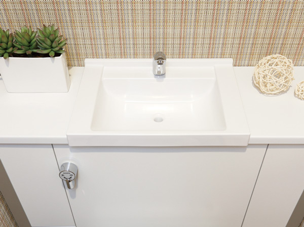 Toilet.  [Hand wash basin] At the top of the slim tank with a counter to feel the room and clean, We have established the wash-basin.