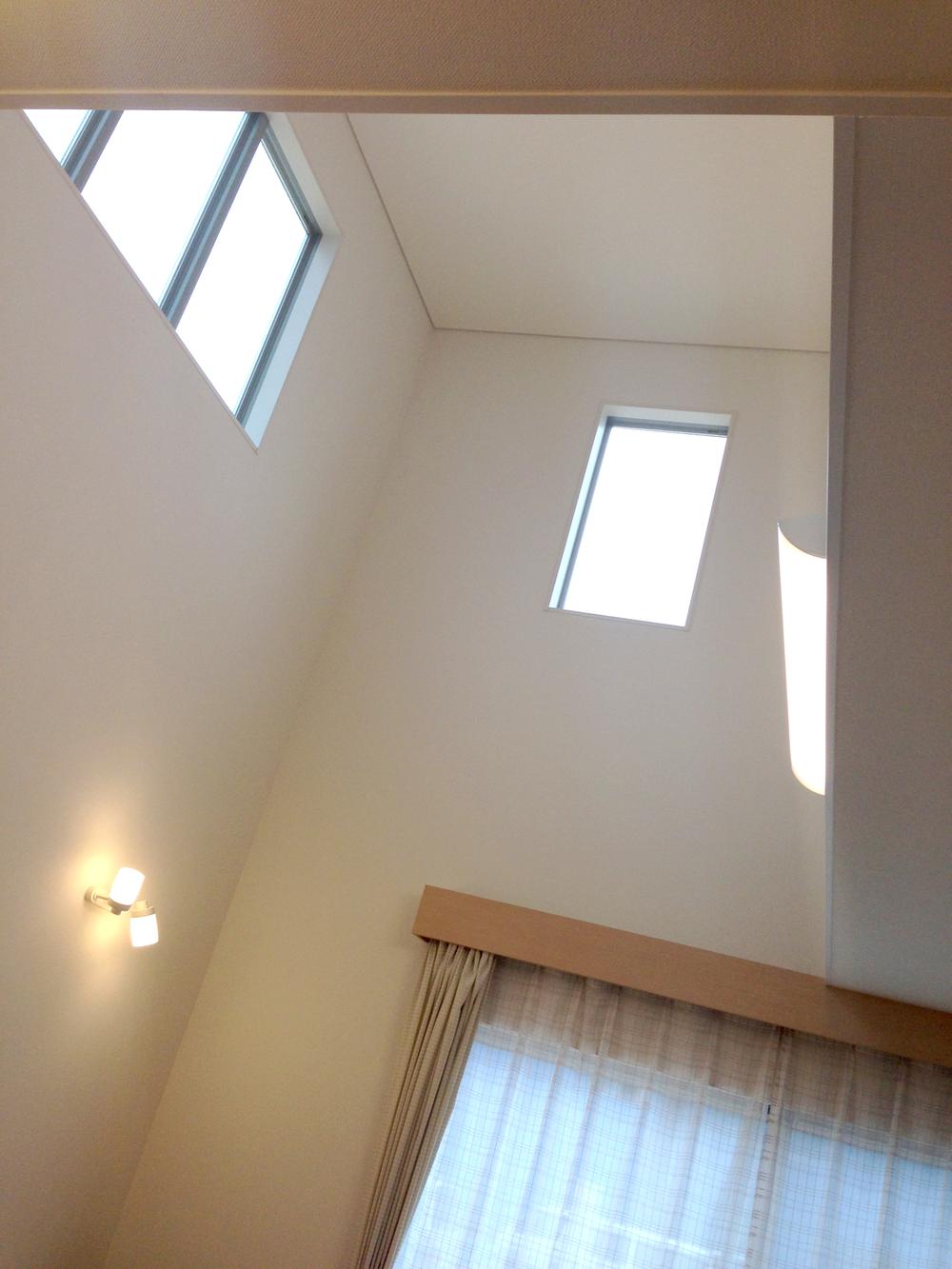 Living. Day is poured into a much dazzling from the high ceiling.